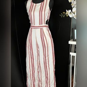 Japna women’s short sleeved jumpsuit with cutouts on each side.